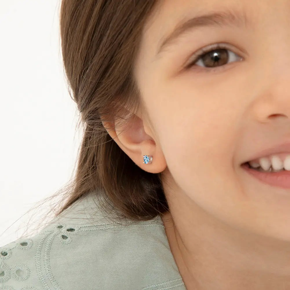 Zilveren kinderoorbellen: Kristal Licht blauw met schroefsluiting